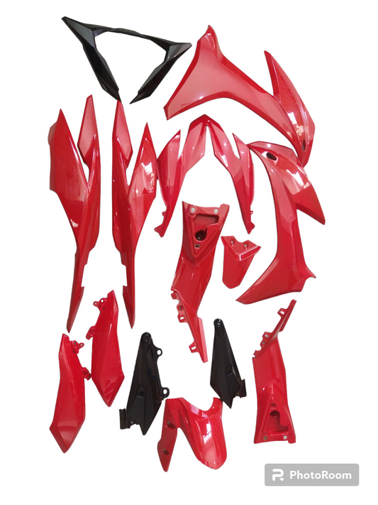 A set of red motorcycle covers and parts laid out on a white background.